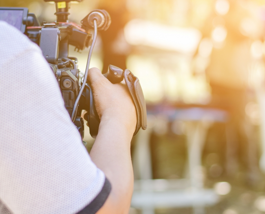 back side of cameraman in work